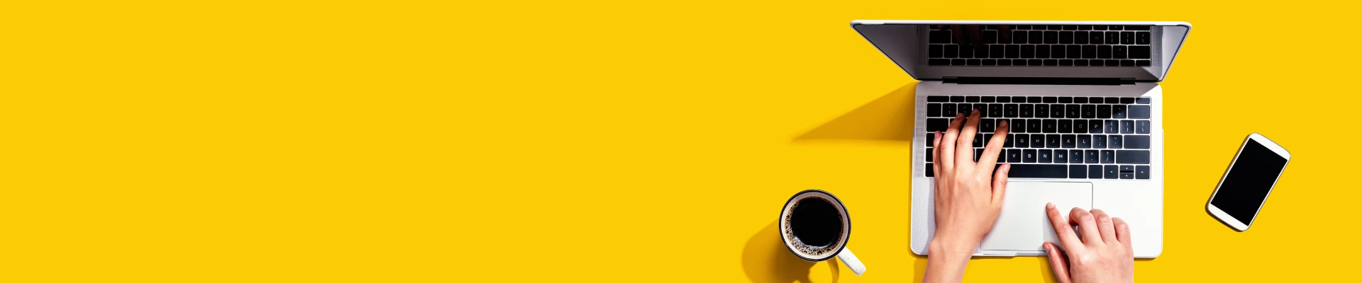 laptop in a yellow background
